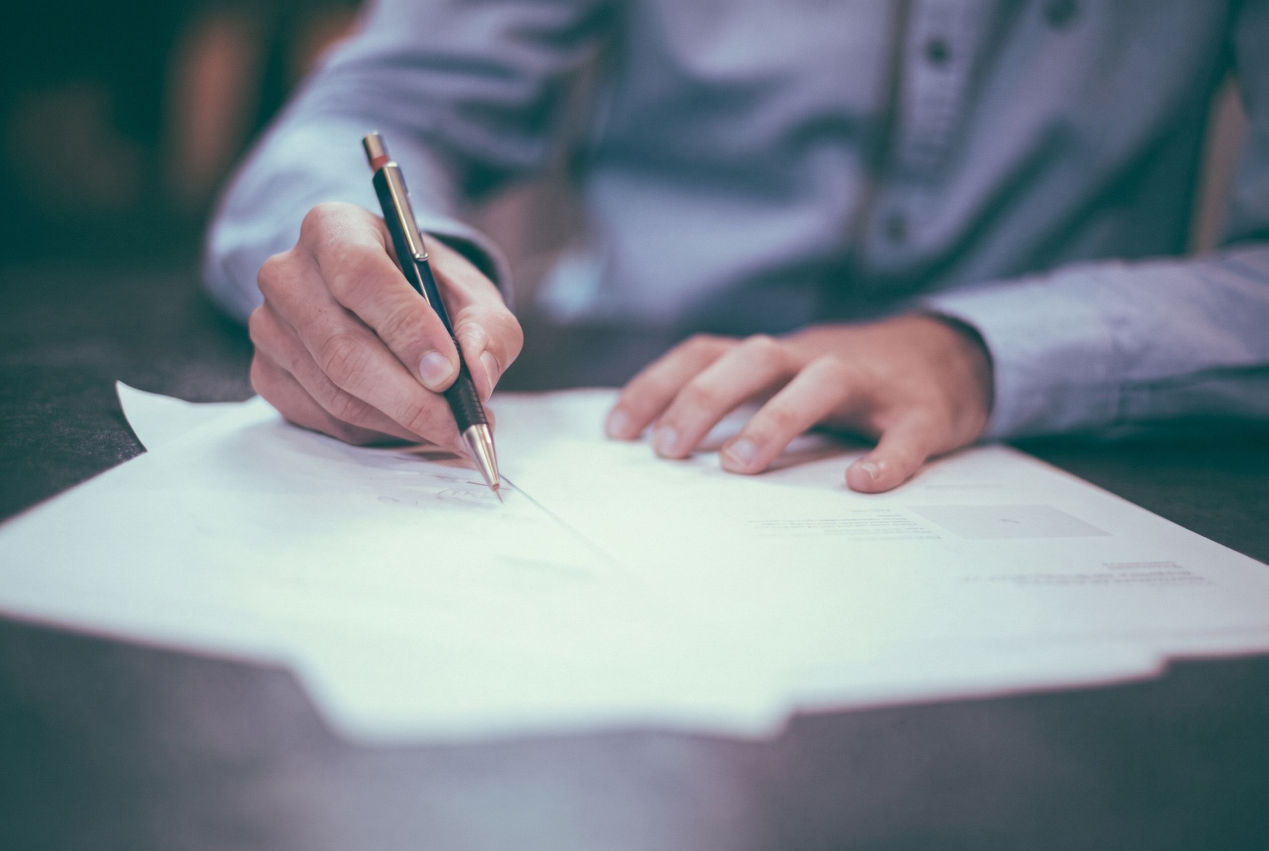 A license application being signed